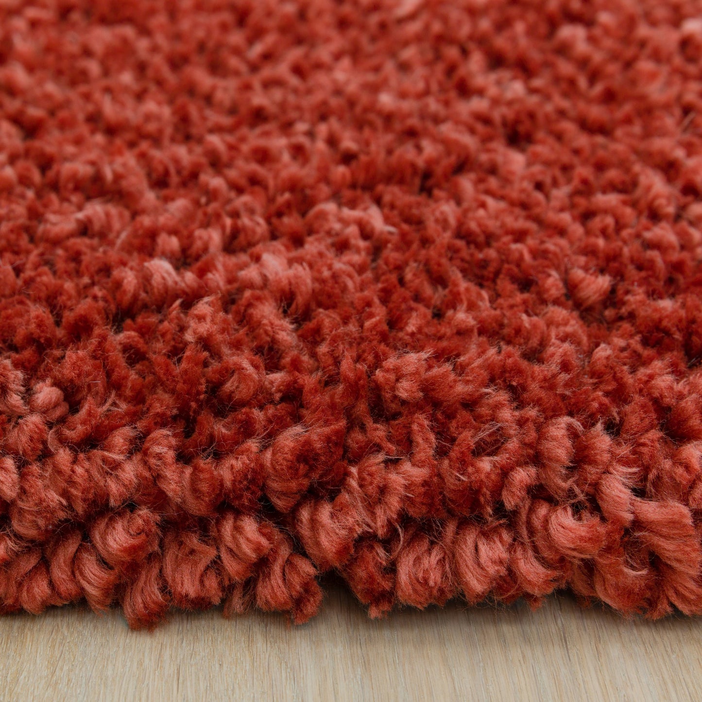 Spiral Plain Shaggy Rugs in Coral orange