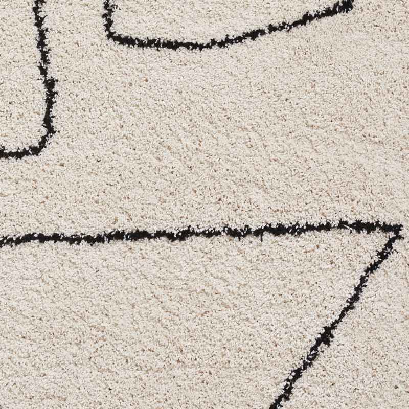 Boho A474 Tassel Hem Geometric Rugs in White Black