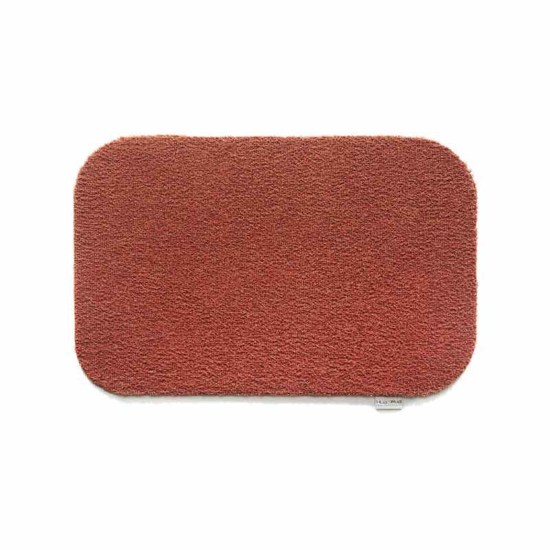 Plain Fleck Washable Hug Rug Doormat in Terracotta