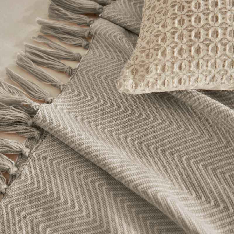 Serenity Herringbone Woven Throw by Katie Piper in Linen