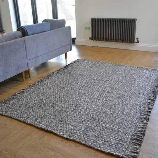 Bergen Plain Tassel Wool Rugs in Charcoal Grey